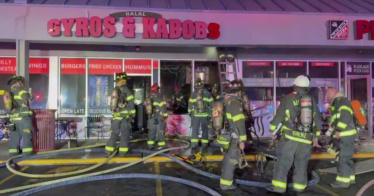 Business damaged in overnight fire at Denver area shopping center
